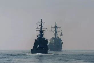 us aircraft carrier shoots down iranian drone in arabian sea amid rising tensions