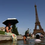 people cool off in the trocadero fountain in front of the eiffel tower as temperatures rise in paris 244851794 1x1 1